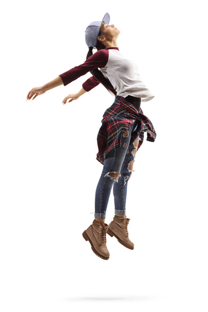 Young woman dancing and performing a jump - Fotografie, Obrázek