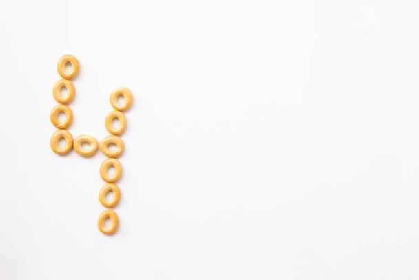 number 4 made from cookies on a white background with space for text. layout for school or diet - 写真・画像