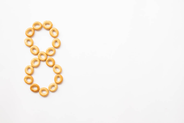 number 8 made from cookies on a white background with space for text. layout for school or diet - 写真・画像