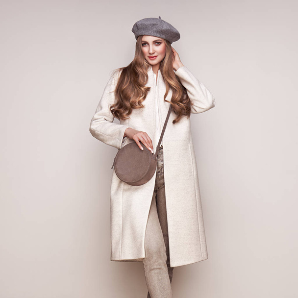 Young woman in white autumn coat - Zdjęcie, obraz