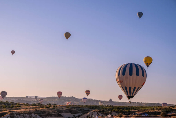 Hot air balloon flying over spectacular Cappadocia. - Photo, Image