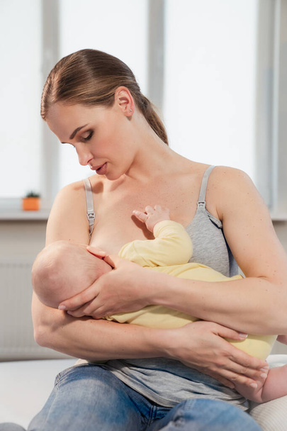 mother breastfeeding baby at home. Breastfeeding mother with little child - Φωτογραφία, εικόνα