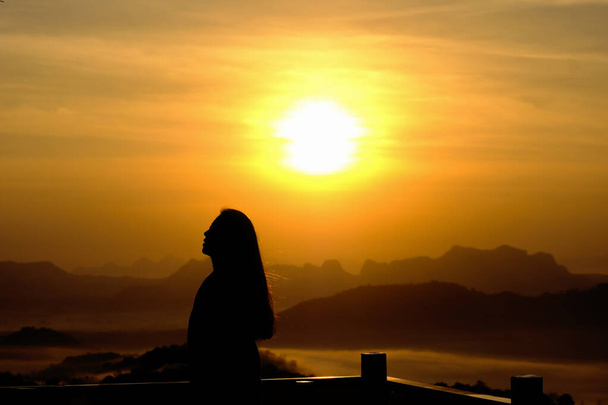 Young woman relaxing in summer sunrise or sunset sky outdoor peo - Photo, Image