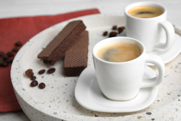 Delicious coffee and wafers for breakfast on tray, closeup. Space for text - Foto, imagen