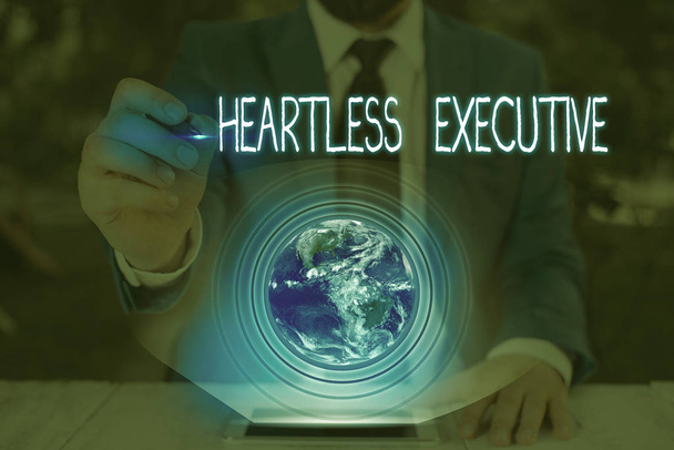 Conceptual hand writing showing Heartless Executive. Business photo text workmate showing a lack of empathy or compassion Elements of this image furnished by NASA. - Photo, Image