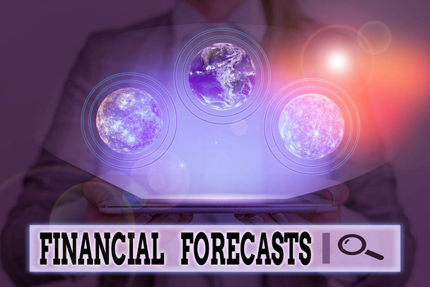 Writing note showing Financial Forecasts. Business photo showcasing estimate of future financial outcomes for a company Elements of this image furnished by NASA. - Photo, Image