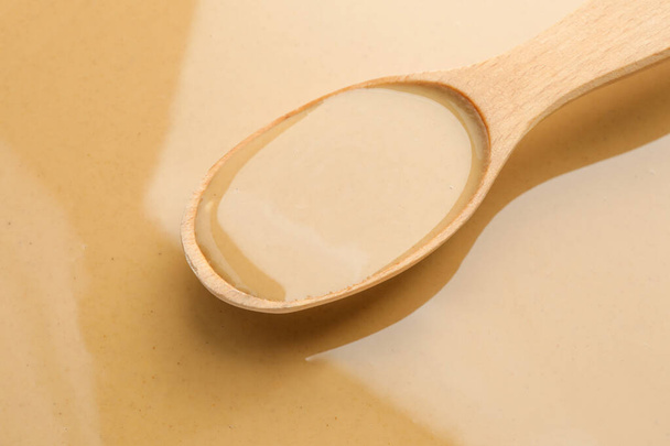 Spoon with tasty tahini, closeup - Valokuva, kuva