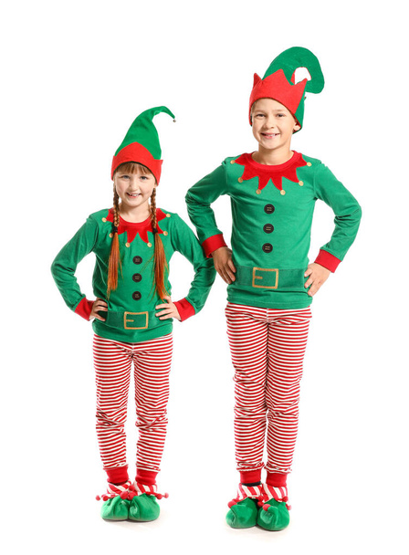 Little children in costume of elf on white background - Foto, afbeelding