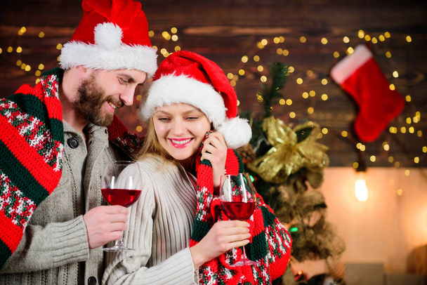 Loving hearts. Man woman lovely celebrating new year. Celebrating winter holiday. Couple in love enjoy red wine. Romantic celebration. Merry christmas. Celebrating together. Dearest people concept - Photo, Image