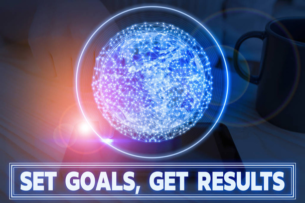Writing note showing Set Goals, Get Results. Business photo showcasing Establish objectives work for accomplish them Elements of this image furnished by NASA. - Photo, Image