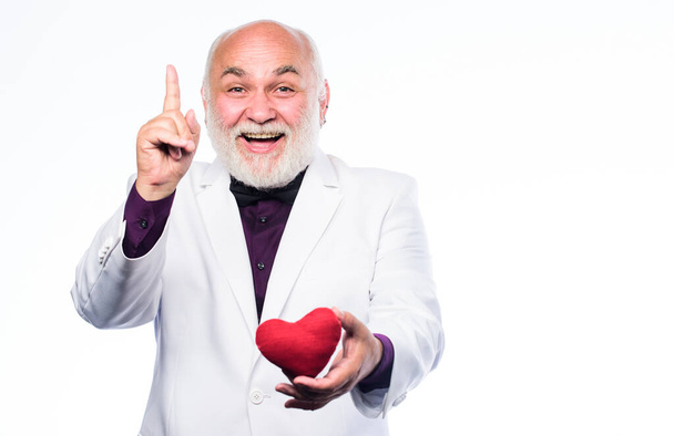 great idea. happy mature man hold red heart. valentines day. donor transplant. bearded businessman. heart failure. love and romance. Health care treatment. problems with heart - Fotoğraf, Görsel