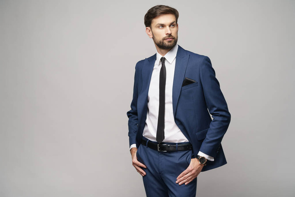 studio photo of young handsome businessman wearing suit - Fotoğraf, Görsel