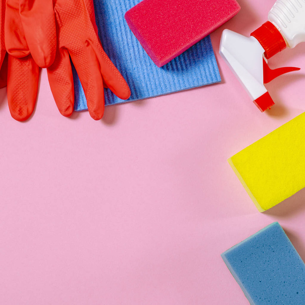 Colorful cleaning set for different surfaces in kitchen, bathroom and other rooms. Cleaning service concept - 写真・画像