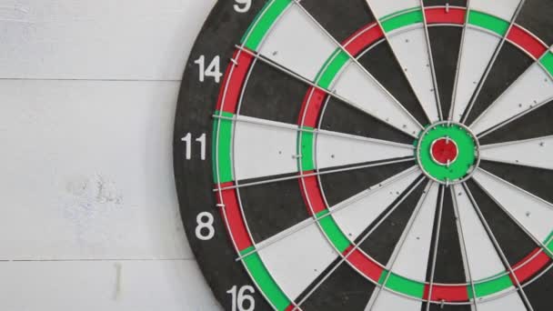 Successful throw forward and red arrow in center of dart. Close-up view - Footage, Video