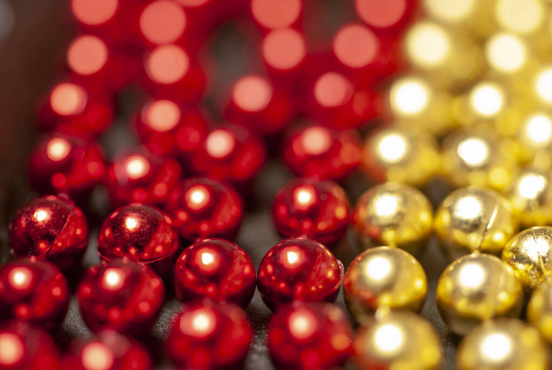 garlands-beads of red and gold color - Foto, immagini