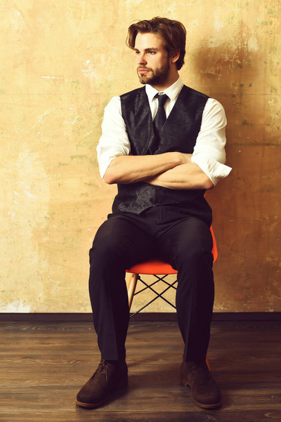 man or serious businessman on chair waiting for job interview - Foto, Imagen