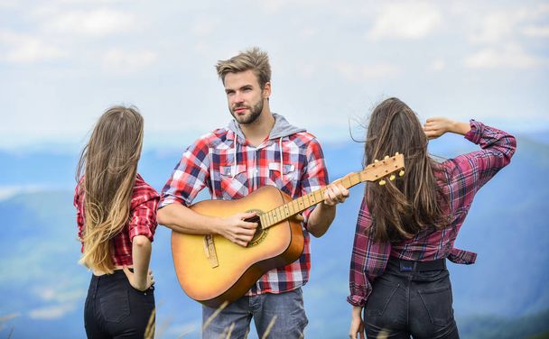 Camp songs. group of people spend free time together. family camping. hiking adventure. happy men and girls friends with guitar. friendship. romantic picnic in tourism camp. campfire songs - Photo, image