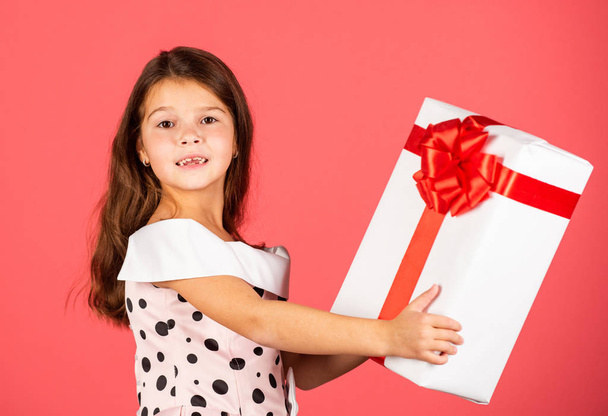 This is for you. little girl carry present. big christmas sale. kid hold gift box. boxing day concept. dreams come true. happy new year. winter holiday and xmas joy. seasonal shopping discount - Valokuva, kuva
