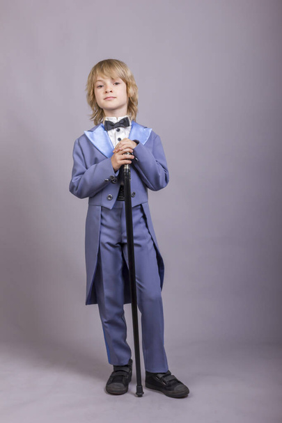 Cute child dressed like gentleman. - Foto, imagen