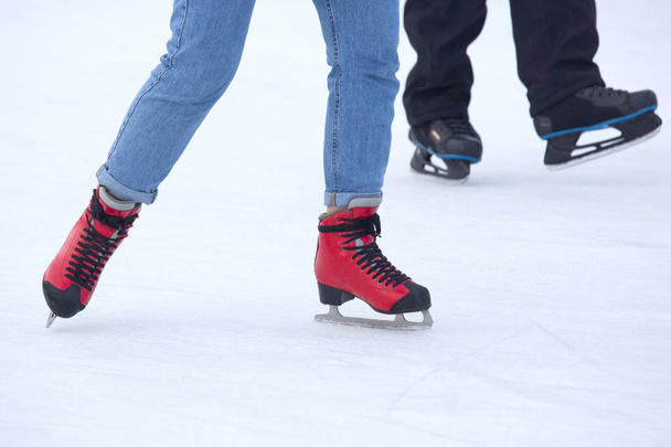 different people are actively skating on an ice rink. Hobbies an - Photo, Image