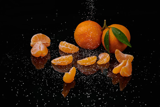 Tangerines mandarines with water drops on black background. New  - Φωτογραφία, εικόνα