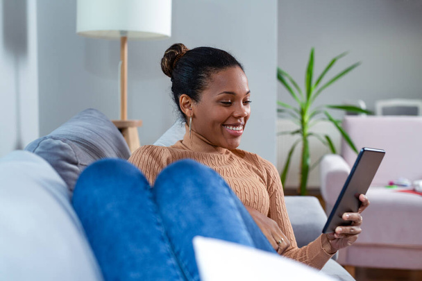 Happy African Woman Looking At Digital Tablet. - Фото, изображение