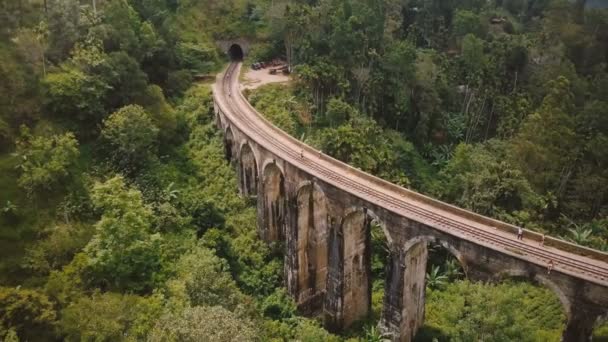 drone flying left and turning to reveal magnificent wide panoramic aerial view of nine arch bridge ella in sri lanka - Footage, Video
