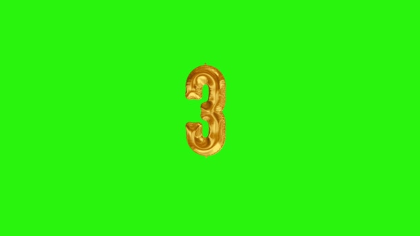 Número 3 tres tres tercer año celebración globo de lámina de oro flotando en verde
 - Metraje, vídeo