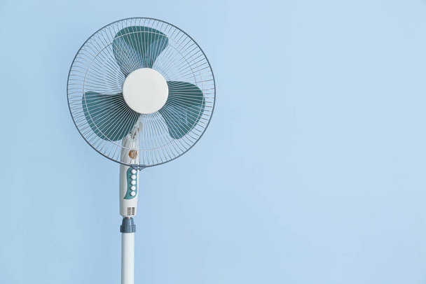 Modern electric fan on color background - Photo, Image