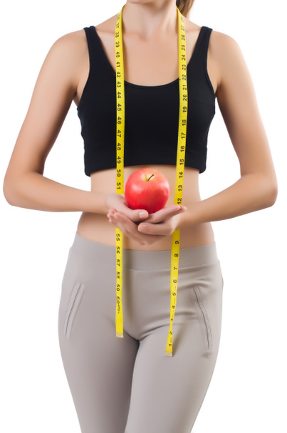Femme avec pomme faisant des exercices sur blanc
 - Photo, image