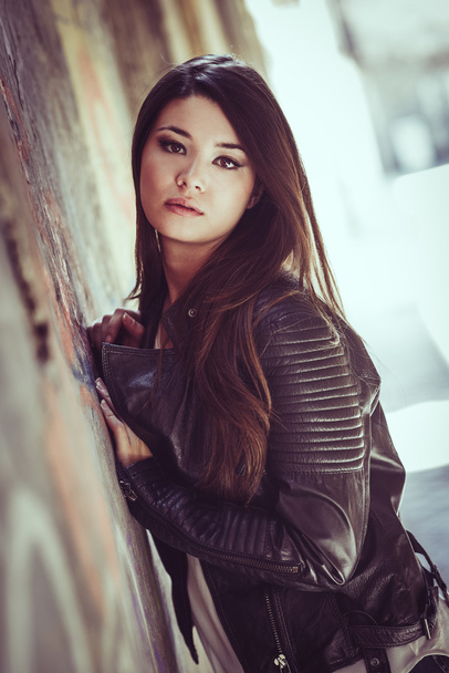 Beautiful japanese woman in urban background wearing leather jac - Zdjęcie, obraz
