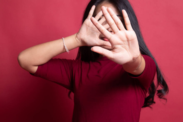 Young Asian woman hide her  face. - Fotografie, Obrázek