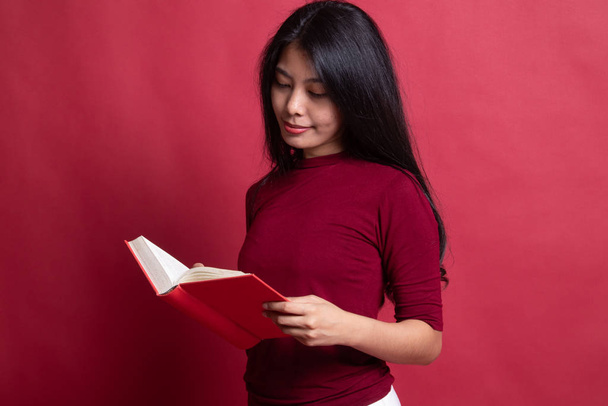 Young Asian woman read a book. - Фото, изображение