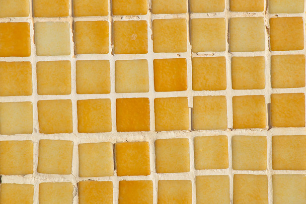 yellow wall made of small tile cubes as background - Fotografie, Obrázek