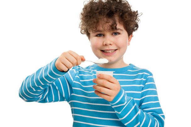 Boy eating yogurt - Foto, Imagem