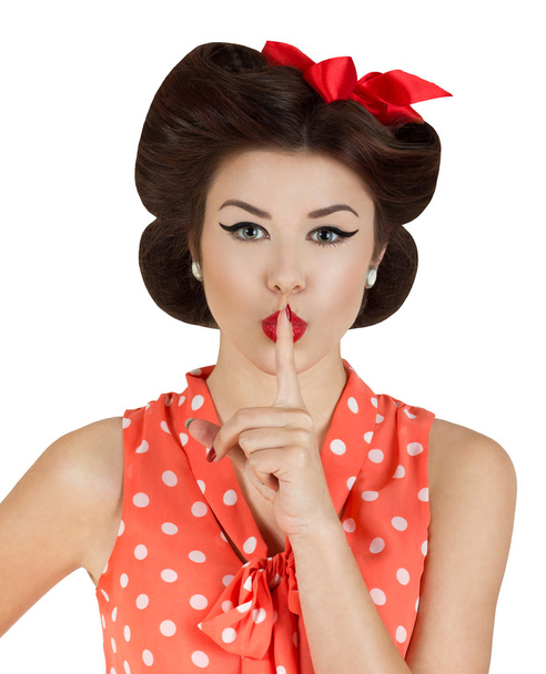 Pin-up style girl with finger on lips - Foto, afbeelding