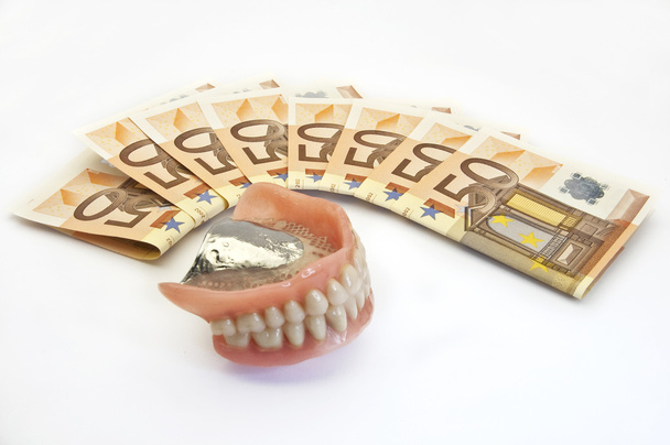 Money and denture - Photo, Image