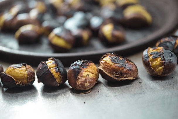 Group of roasted chestnuts for sale on the street - Foto, Imagem