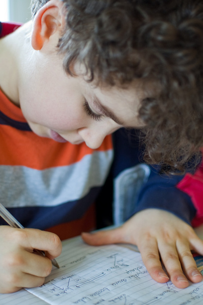 Boy doing homework - Foto, Bild