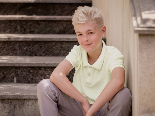portrait of cute handsome blonde eleven old boy (teenager). Growing up, chilhood, separating concept - Fotografie, Obrázek