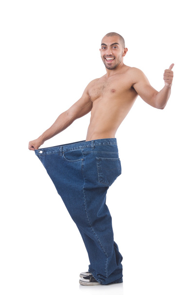 Homem em dieta conceito com jeans de grandes dimensões
 - Foto, Imagem