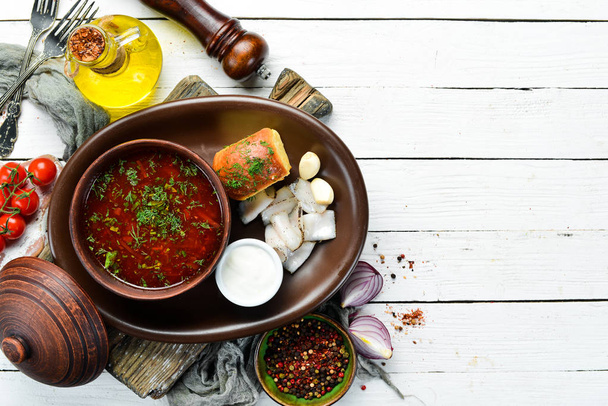 Beet borsch with lard and sour cream. Ukrainian cuisine. Top view. free space for your text. Rustic style. - Foto, Imagem