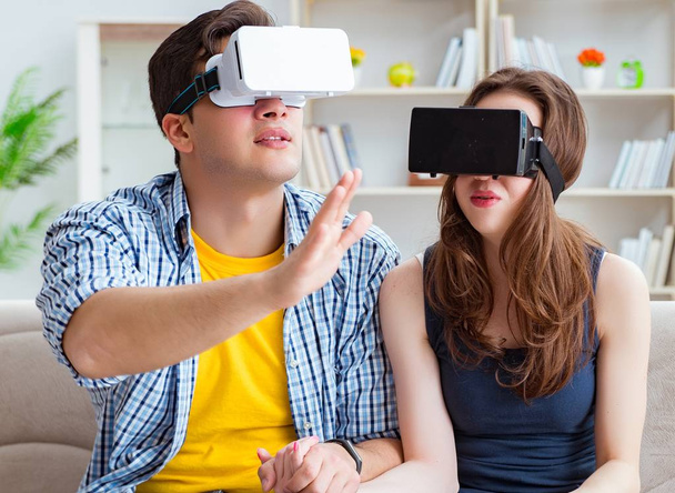 Young family playing games with virtual reality glasses - Fotoğraf, Görsel