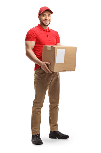 Delivery man holding a package  - Photo, Image