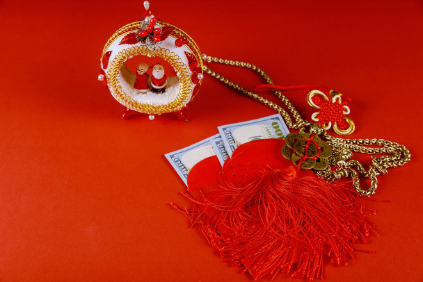 Chinese new year symbol decorations ornament Ang Pau money packet on red background - Photo, Image