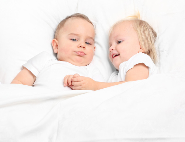 Little siblings in bed. Happy family concept. - Photo, Image