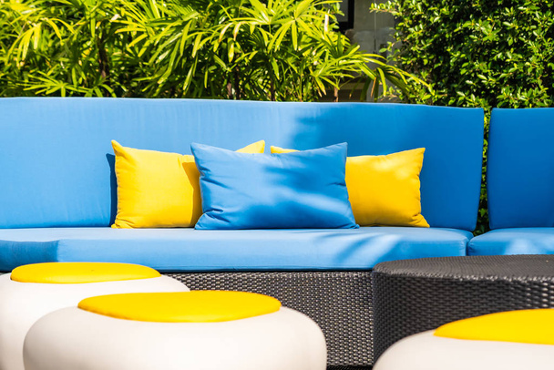 Outdoor patio in the garden with sofa chair and pillow decoratio - 写真・画像