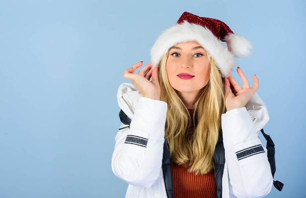 New year new goals. happy new year. merry christmas. morning before xmas. winter holidays and vacation. woman in down jacket. girl santa claus hat. padded coat fashion. warm clothing. fun and gifts - Fotó, kép