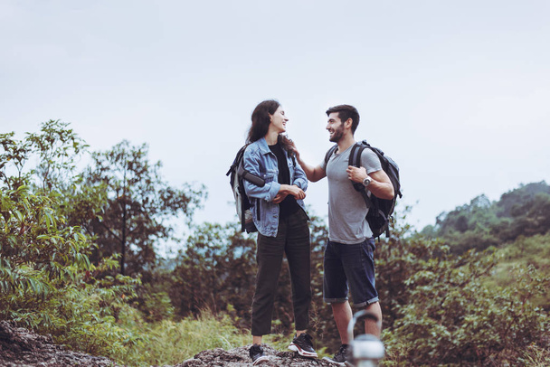 Couple young lover standing and talking at nature together,Happy and smiling ,Enjoying camping concept - Foto, imagen