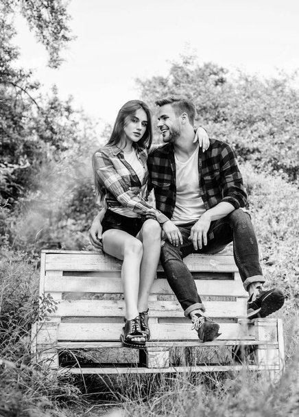 Youth hang out. Summer vacation. Enjoying nice weekend together. Boyfriend and girlfriend in love. Love and romance concept. Family weekend. Romantic date in park. Couple in love sit on bench - Фото, изображение
